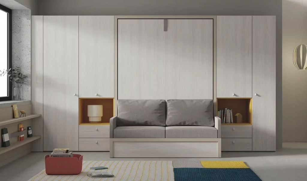 Habitación diferente con cama abatible de 150 vertical con sofá y armarios