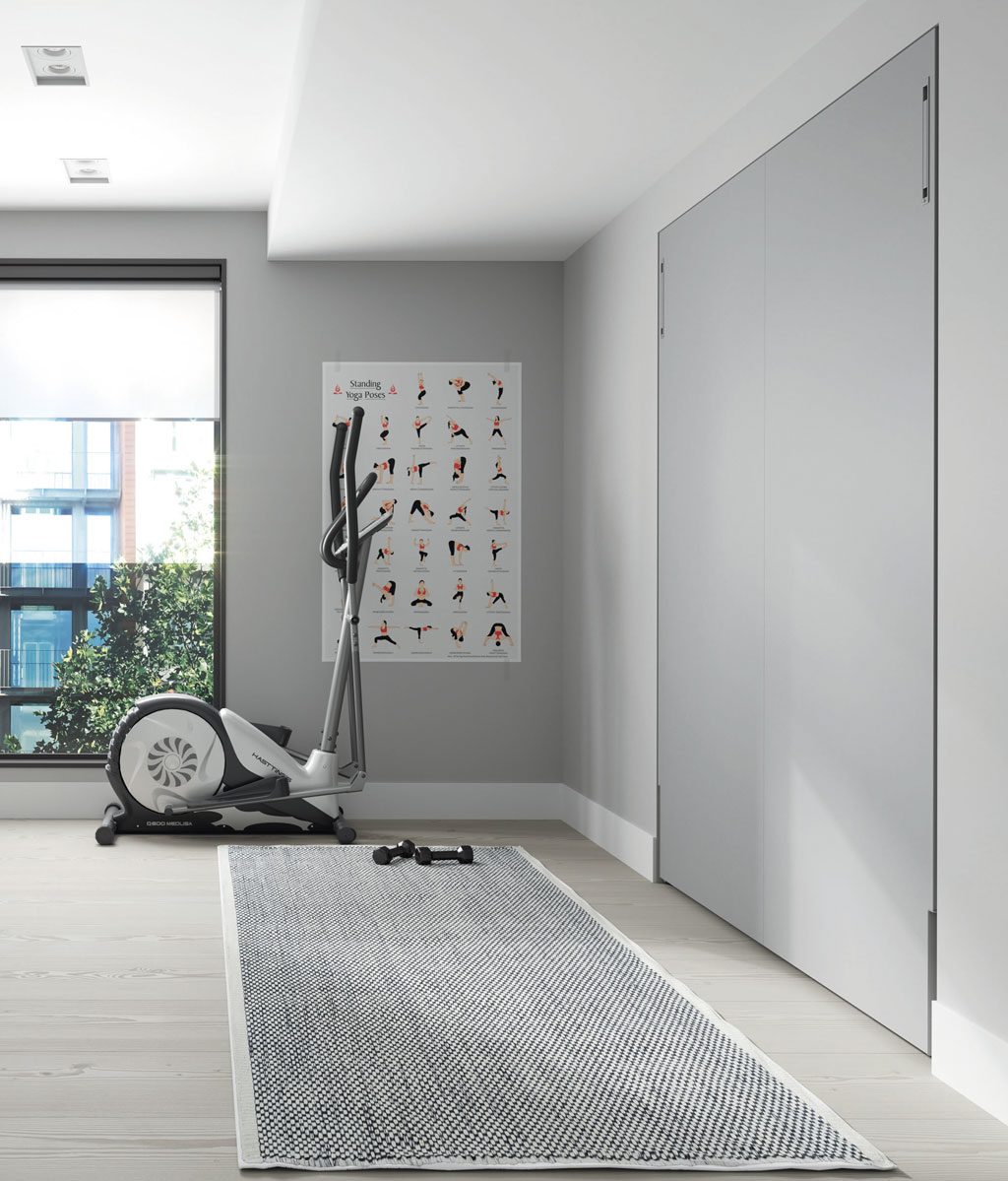 Cama abatible vertical de 190x150 cm cerrada empotrada en la pared
