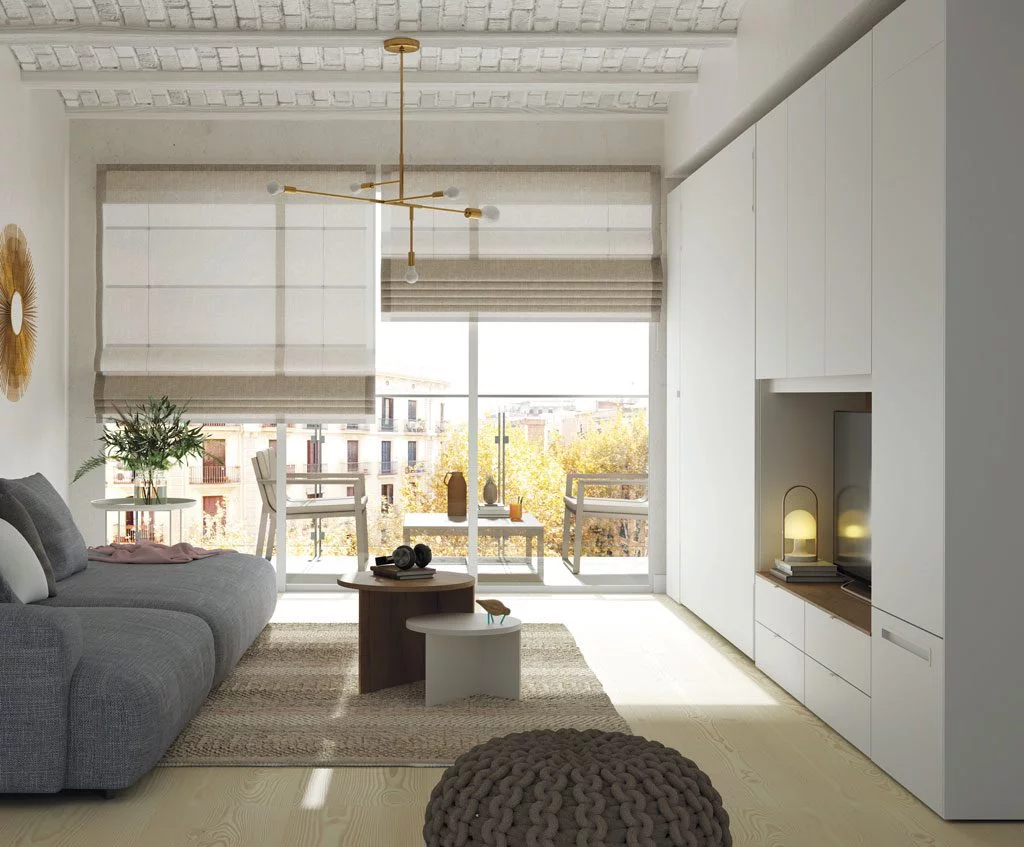 Cama abatible vertical integrada en los muebles de este Loft