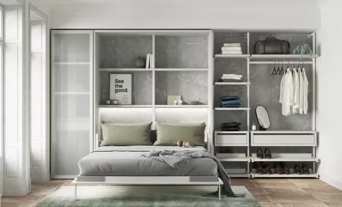 Dormitorio con cama de matrimonio abatible vertical y vestidor abierto